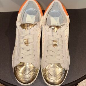 Dolce Vita Women's White and Gold Sneakers with Orange Accents